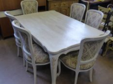 A French Style Pine Ivory Finish Dining Table, 100 x 150 x 73 cms, together with six chairs on