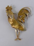 A Bespoke 18 ct Yellow and White Gold Cockerel Brooch, the brooch hand crafted and having ruby