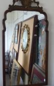 An Antique Chippendale Style Wall Mirror, the mirror having a straight and scalloped edge with shell