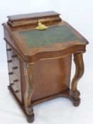 A Victorian Rosewood and Mahogany Davenport, having four real drawers, top ink box and pen stand and