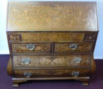 An Antique Dutch Marquetry Inlaid Bombe Bureau, having a well fitted tiered interior with profuse