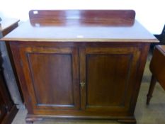 An Victorian Mahogany Sideboard, with two cupboards beneath supported on bracket feet.