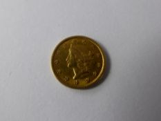A Solid Gold United States of America 1 Dollar Coin, dated 1851.(fc)