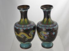 A Pair of Chinese Cloisonné Vases. The vases depicting yellow chasing dragons having acanthus leaves
