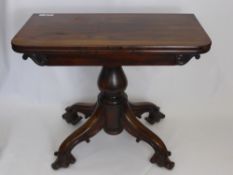 An Antique Rosewood Tea Table by A. Blain Liverpool, the table having bulbous supports on scroll