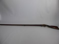 An Antique North African Flintlock Musket, with Continental influence, checkered wrist and scroll