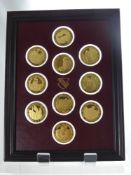A Set of Ten Sterling Silver 24 ct Gold Plated Franklin Mint Commemorative Coins, commemorating