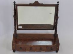 An Antique Mahogany Dressing Table Mirror, having three drawers with box inlay supported on shaped