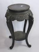 An Ebonised Oriental Style Occasional Table, with key design to top, four legs on bun feet, approx