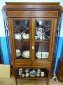 An Inlaid Edwardian Display Cabinet, the cabinet has glazed front with two central drawers and a