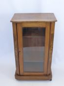 A Victorian Burr Walnut Inlaid Music Cabinet, boxed stringing with glazed front and two internal