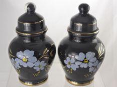 A Pair of Victorian Glass Jars with Covers hand painted with blue flowers and gilt highlights.