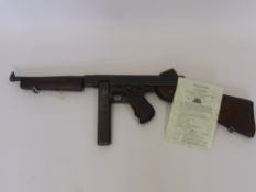 A WWII Thompson M1A1 Sub Machine Gun, early deactivation, the gun cocks, strips and all parts