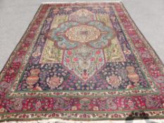 A Persian Tabriz Woollen Hand Knotted Carpet, approx 242 x 365 cms, of typical floral design.