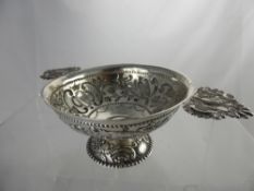 A Circa 19th Century Continental Quaich, the vessel embossed with birds in relief with fret work