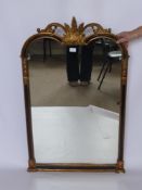 A Gilt, Wood and Ebonised Contemporary Mirror, with decorative floral carvings to top and side,