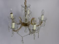 Two Brass, Gilt and Glass Six Branch Chandeliers.