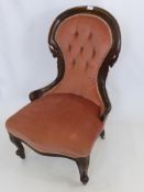 An Victorian Velvet Covered Nursing Chair, on porcelain castors.