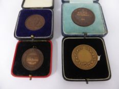 Five Bronze Athletics Prize Medallions, including Oxford/Cambridge vs American Universities