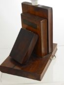 An Antique Wooden Lamp Base, depicting three books, understood to be made from timber of Nelson's