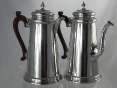 A Silver Coffee and Water Pot, having a tapered cylindrical design with acorn finial. London