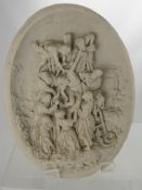 A Marble Wall Plaque, depicting the Crucifixion, signed E Cassiers with a bronze medallion