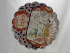 An Antique Meiji Era Japanese Imari Scallop Edged Charger, decorated with mother and child chasing