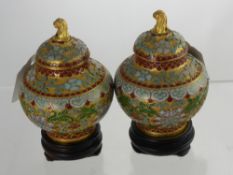 A Pair of Miniature Cloisonné Lidded Vases, the vases having gilded dog of fo finials approx 10 cms,