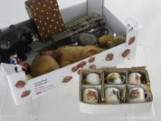 A Box of Miscellaneous Items, including an ebony elephant, treen acorn, American Indian dolly,
