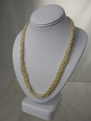 An Antique Strand of Woven Seed Pearls, approx 42 cms long, the necklace having a gold rose cut