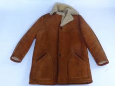 A Gentleman's Vintage Sheep Skin and Lambs Wool Car Coat.