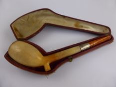 An Antique Meerschaum and Amber Pipe with silver collar in original box.