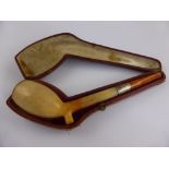 An Antique Meerschaum and Amber Pipe with silver collar in original box.