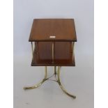 A Victorian Mahogany and Brass Revolving Book Case, the book case having brass rod divisions on