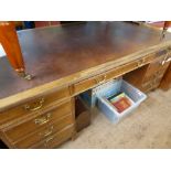 A Vintage Leather Topped Oak Mahogany Fronted Partners Desk, the desk having three doors to top