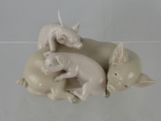 A Porcelain Lladro Figure of a Sow and Piglets.