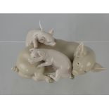 A Porcelain Lladro Figure of a Sow and Piglets.