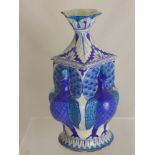 A 19th Century Persian Tin Glazed Stone Ware Vase, of peacock design, the vase having inverted