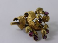 An Edwardian 14 ct Gold and Tourmaline Floral Brooch, 15 gms.