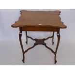 An Edwardian Mahogany Scallop-Edge Tea Table on cabriole style feet, approx 72 x 74 x 73 cms.