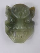 A Chinese Jade Hard Stone Mask Belt Buckle.