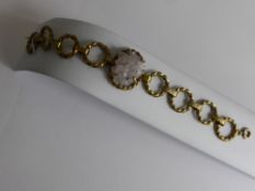 A Vintage Silver Gilt Textured Bracelet, inset with rose quartz matrix, dated Sheffield 1975, mm L &