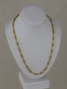 A 9 ct Yellow Gold Tested Knot Link Chain, 15.5 gms.