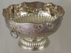 A Large Silver Plated Punch Bowl, the bowl embossed with garlands and having lion mask handles on