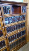 A Globe-Wernicke Co Ltd., Stacking Book Cases, the mahogany inlaid case having astral glazed doors