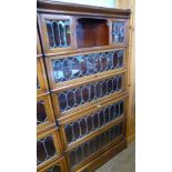A Globe-Wernicke Co Ltd., Stacking Book Cases, the mahogany inlaid case having astral glazed doors