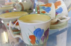 Clarice Cliff 'Crocus' Pattern Tea Set, comprising three cups, four saucers and a sugar bowl. (8)