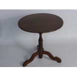 An Antique Oak Tilt-Top Table, on bird cage column and tripod base with swept feet, approx 60 x 63