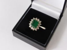 A Lady's 18 ct White Gold Diamond and Square Cut Emerald Ring, size R, approx  wt 5 .6 gms., dias 56