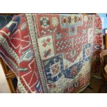 A Large Blue, Cream and Red Turkish Wool Carpet of geometric design, approx 290 x 170 cms.